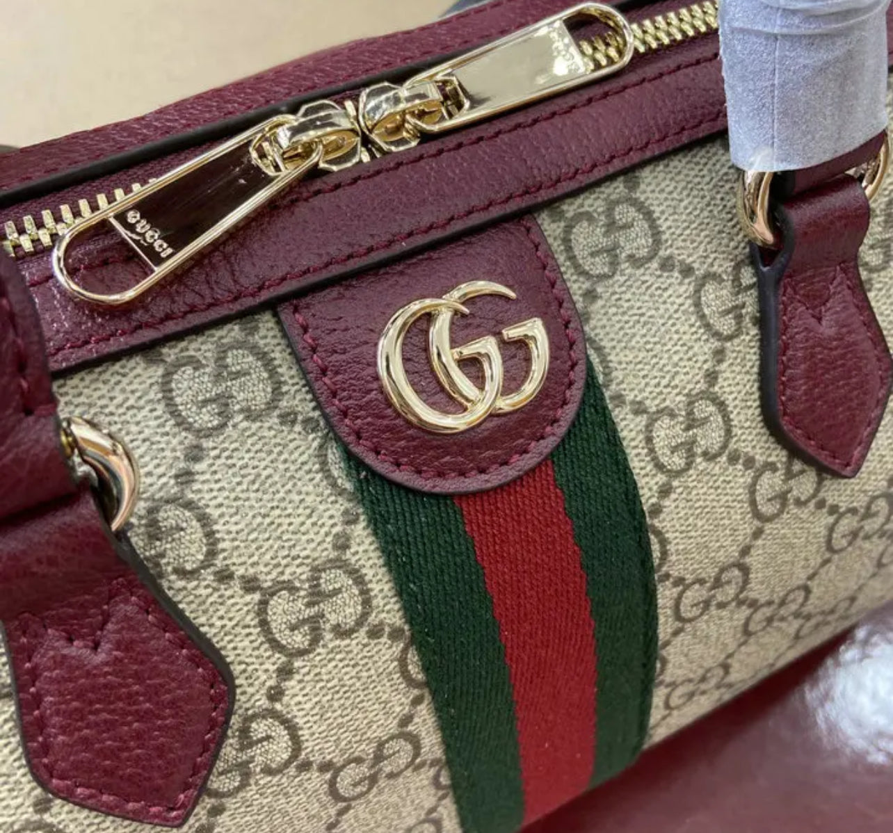 Ophidia Top Handle Bag