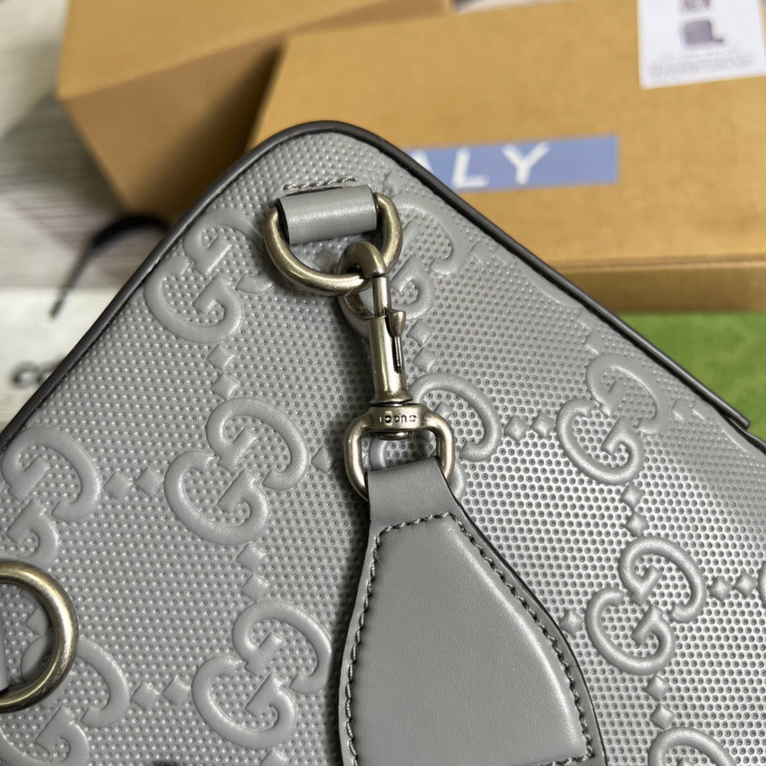 GG Embossed Sling Bag